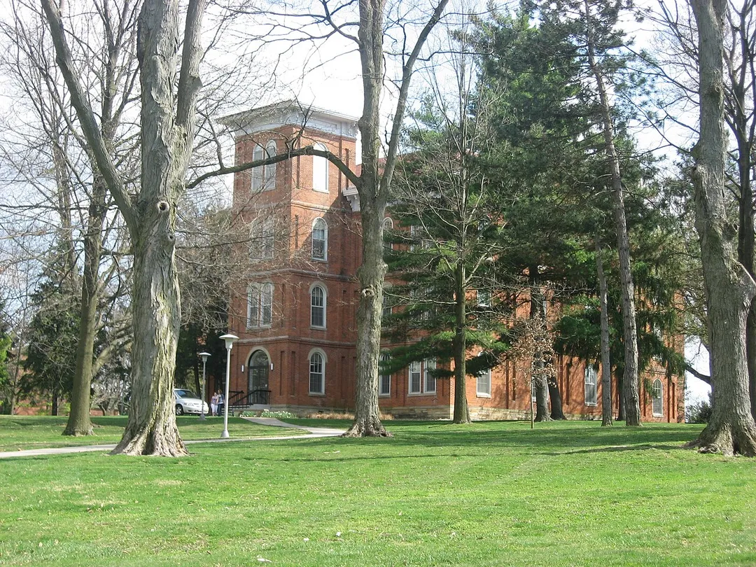 Grounds of Wilmington College, including College Hall.  Photo is taken just southeast of the intersection of College Street with Fife and Rombach Avenues (U.S. Route 22/State Route 3) in Wilmington, Ohio, United States.  Built in 1866 and the oldest building on the campus, College Hall is listed on the National Register of Historic Places.