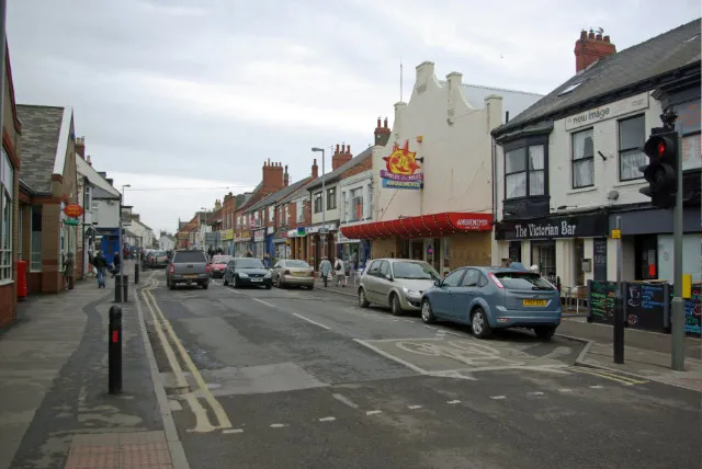 Queen Street, Withernsea, East Riding of Yorkshire, England.Seen here from the junction with Station Road, Withernsea's main shopping street is a rather uninspiring mix of downmarket bars and cheap shops.