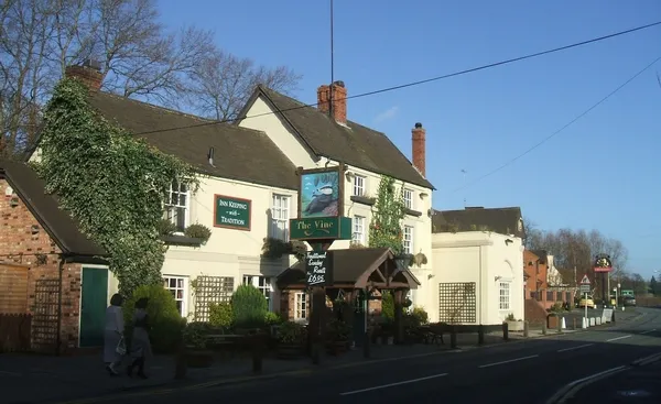 The Vine public house in Wombourne, Staffordshire, Great Britain - a traditional hostelry on the edge of Wombourne village opposite the Police Station. It is a contrast to the more recent pub next door.