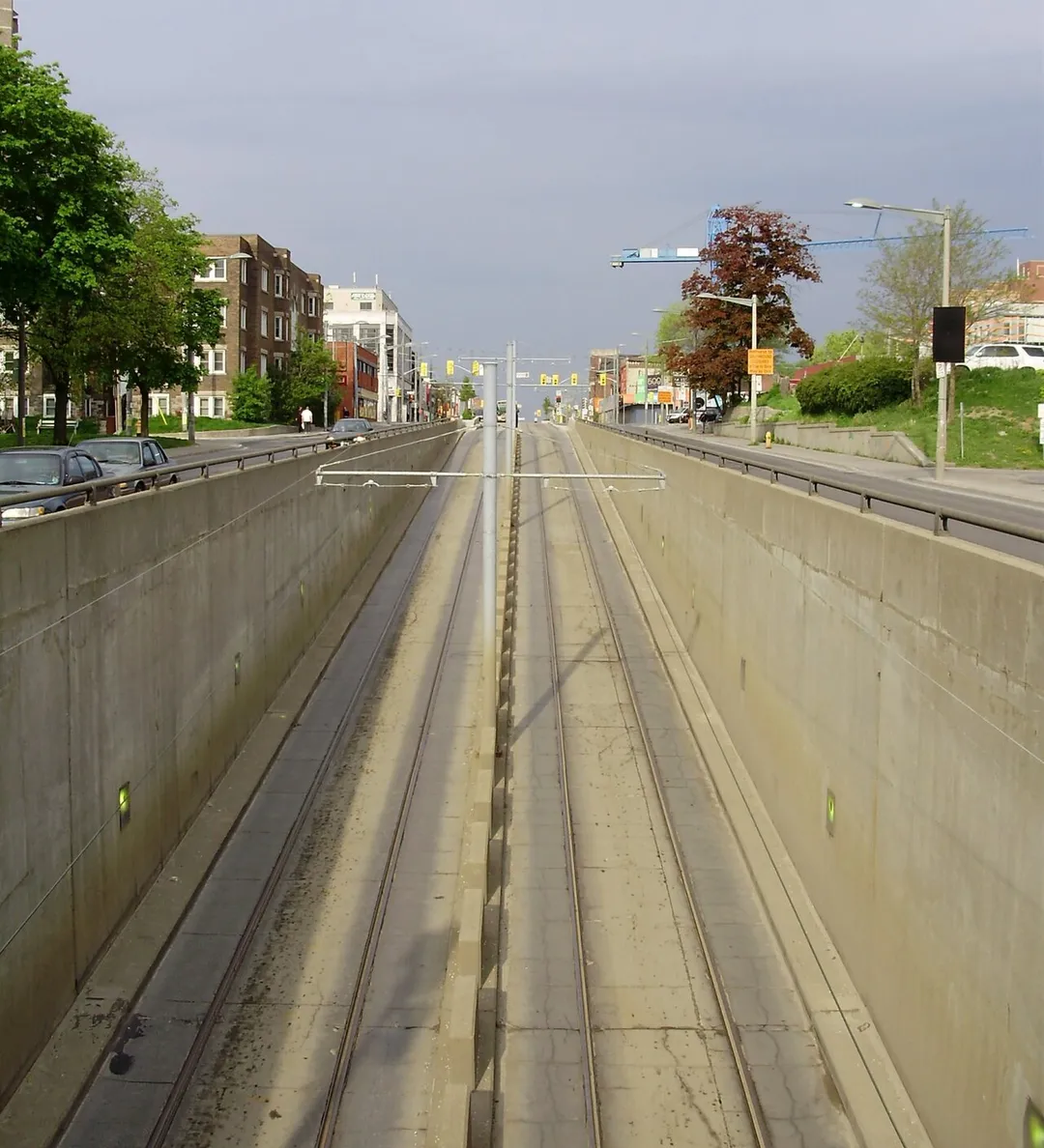 Just west of St. Clair West station on St. Clair Avenue in Toronto, Canada, the middle lanes plunge underground to provide bus and streetcar access to the station.