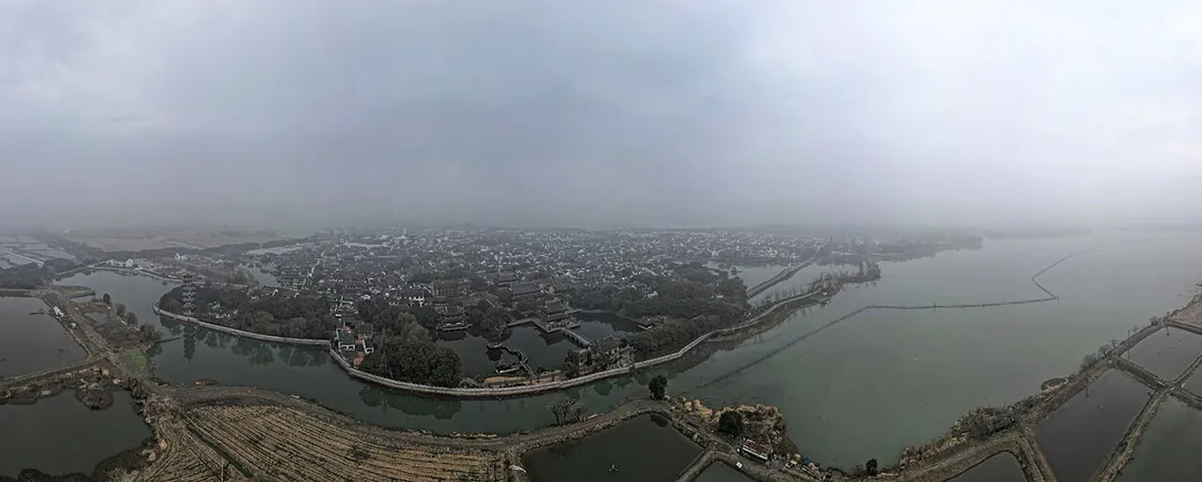 Aerial panorama of Zhouzhuang in Suzhou on a foggy winter's day. December 2023.