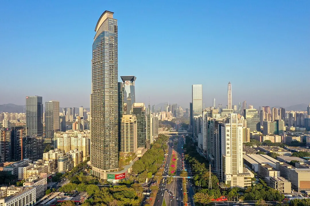 View of Shenzhen's skyline looking east along Shennan Avenue from the Zhutongling Overpass, with Donghai Business Plaza in the foreground.