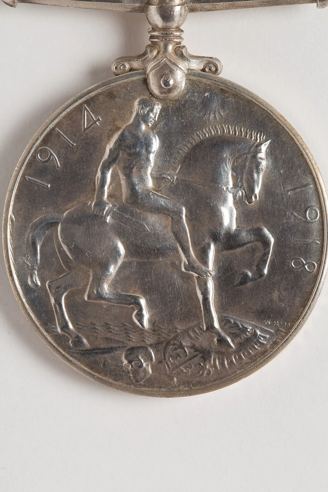 British War Medal 1914-20, WW1 54916 Private Peter Mednis, Auckland Infantry Regiment, N.Z.E.F. circular silver medal; plain straight non-swivelling suspender; ribbon missing obverse- coinage head of King George V with the legend- GEORGIUS V BRITT- OMN- REX ET IND- IMP- reverse- naked figure of St. George on horseback facing right; the horse is trampling on an eagle shield and cross bones symbolic of death; above the horse’s head is the sun, symbolic of victory; around the edge are the dates, 1914 and 1918 ribbon- a broad orange watered band down the centre, bordered with white, black and blue stripes named on edge- 54916 PTE. P. MEDNIS. N.Z.E.F.